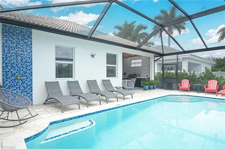 View of pool featuring a patio area and new screen enclosure