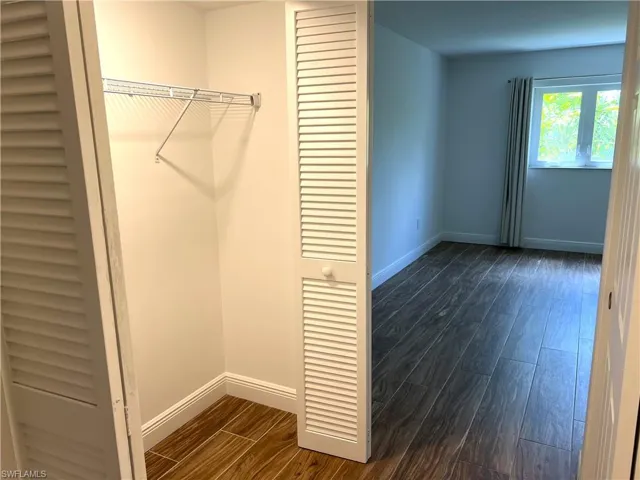 Primary Bedroom - Hall into Primary Suite With Closets on Both Sides of Hall