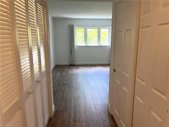 Primary Bedroom - Hall into Primary Suite With Closets on Both Sides of Hall