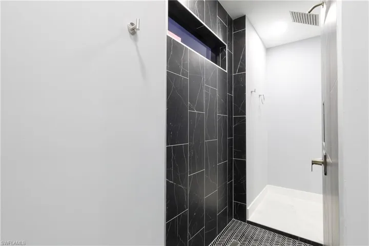 Full bathroom with a tile shower