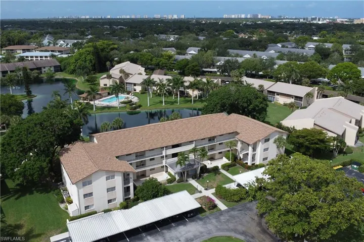 Aerial perspective of suburban area featuring a large body of water