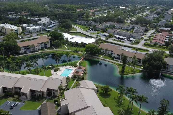 Aerial overview of property's location with a large body of water and nearby suburban area