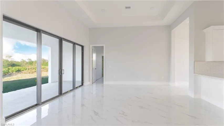 Spare room with a healthy amount of sunlight