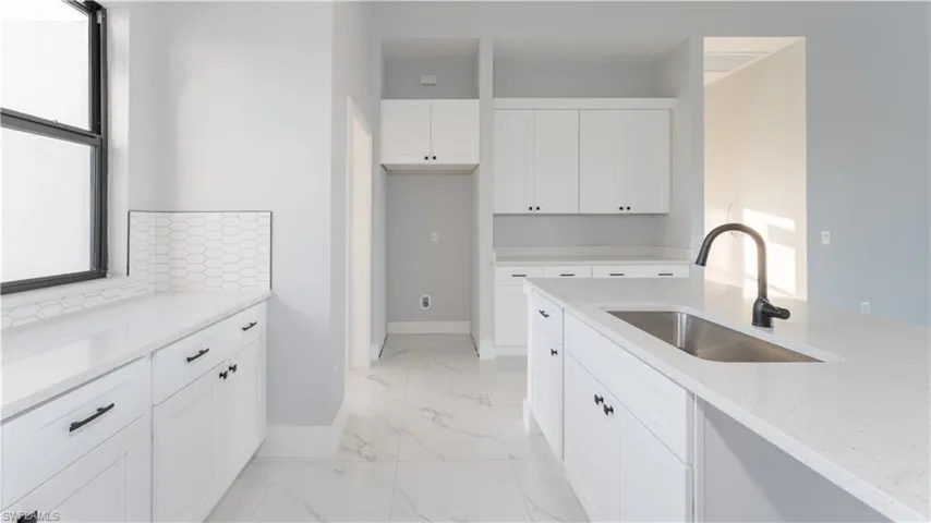 Laundry room featuring sink