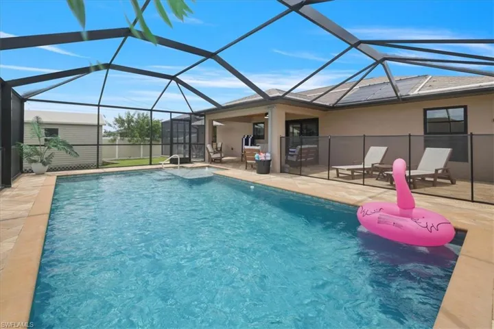 Swimming pool with a patio and a lanai