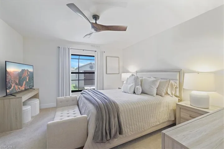 Bedroom featuring carpet flooring and ceiling fan