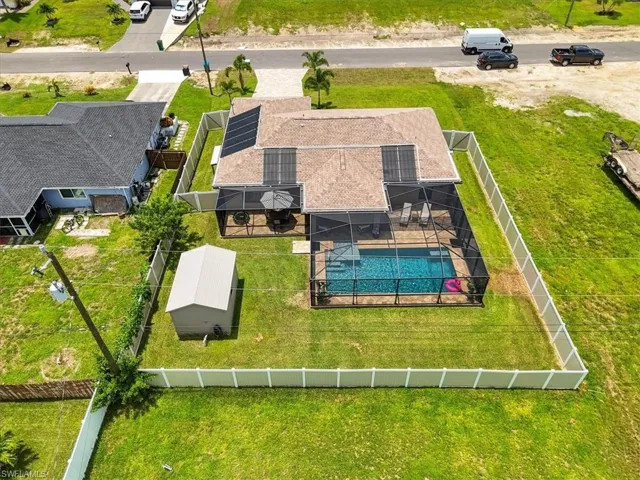 View of subject property featuring a pool area