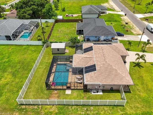 View from above of property featuring a pool area