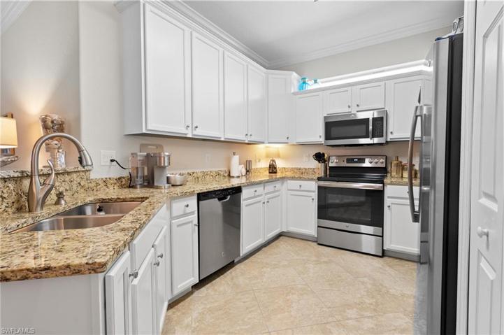 Spacious kitchen with granite and stainless appliances