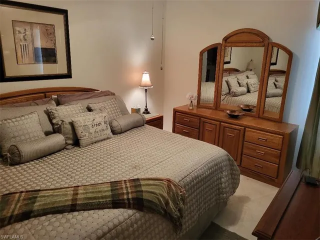 Bedroom with light carpet