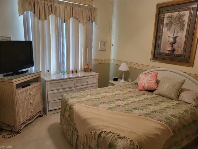 Bedroom Featuring Light Carpet
