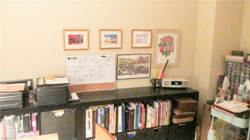 Front Located bedroom used  as office by current tenant. Window facing pool and river plus Glass door direct access to Lanai