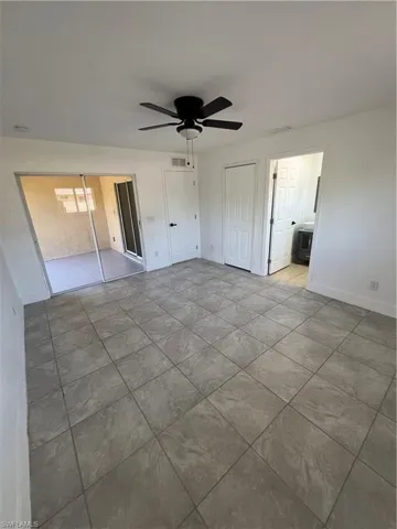 Unfurnished bedroom featuring a ceiling fan and a closet