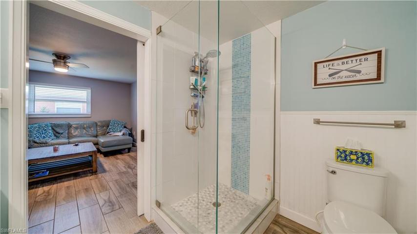 En Suite Bathroom with dual sinks and custom tile shower