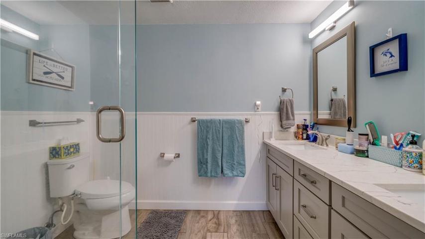 En Suite Bathroom with dual sinks and custom tile shower