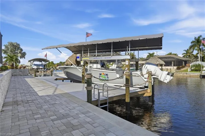 Dock area featuring a water view and boat lift