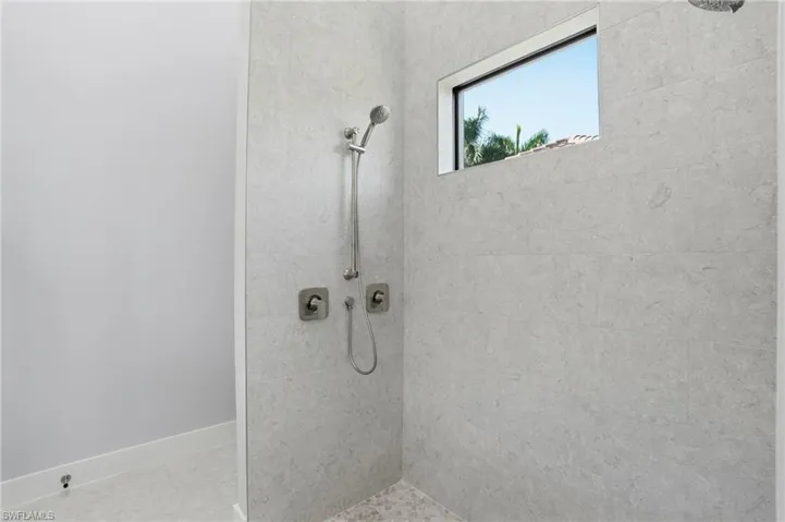 Full bathroom with a tile shower