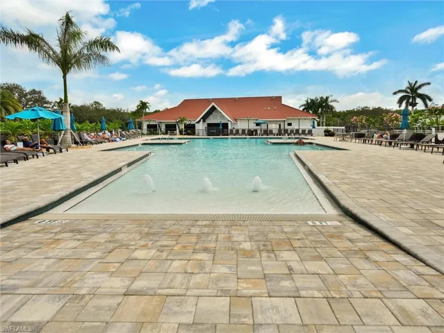 Community pool with a patio area