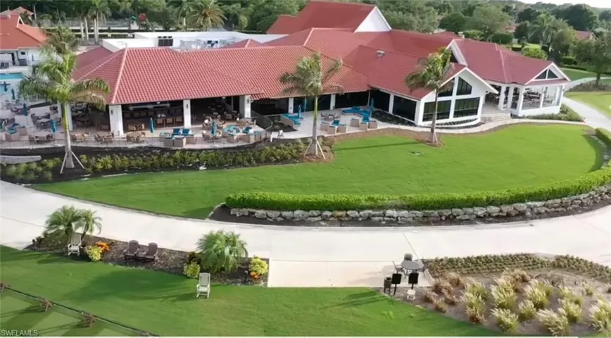 View of community featuring a patio, a yard, and a sunroom