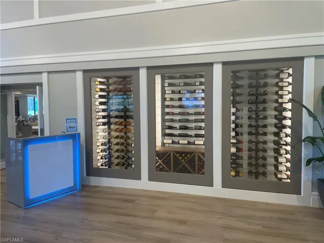 Wine room featuring wood finished floors