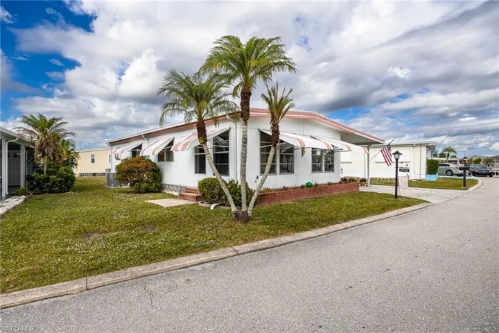 View of front of house with a front yard