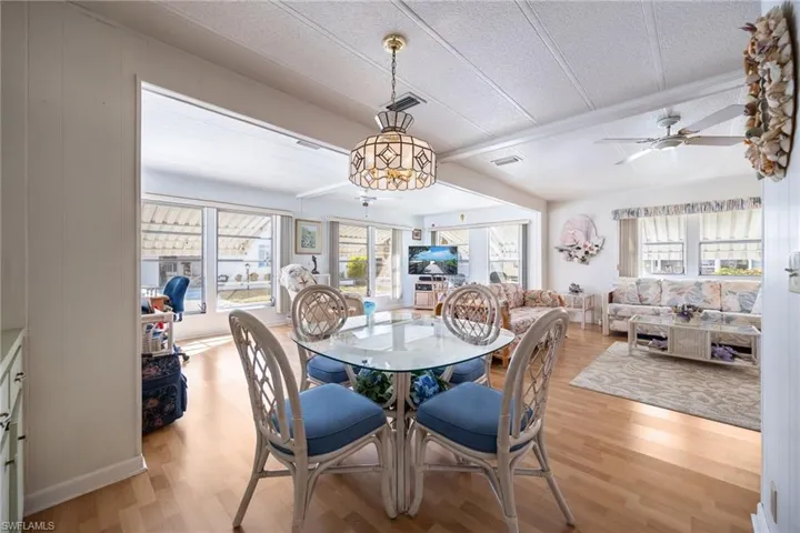 Dining room featuring light wood-style flooring and a textured ceiling