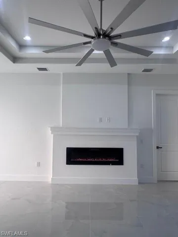 Contemporary fireplace feature wall with decorative mantel and integrated electric fireplace