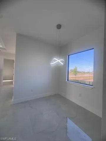 Modern interior space featuring a contemporary infinity-style pendant light