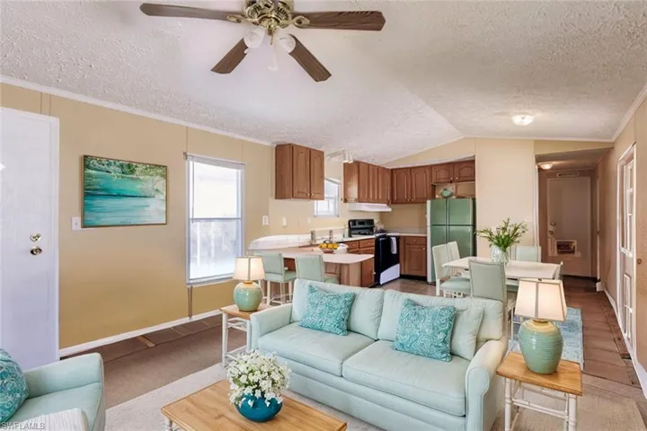 Virtually staged open concept design living, kitchen and dining areas