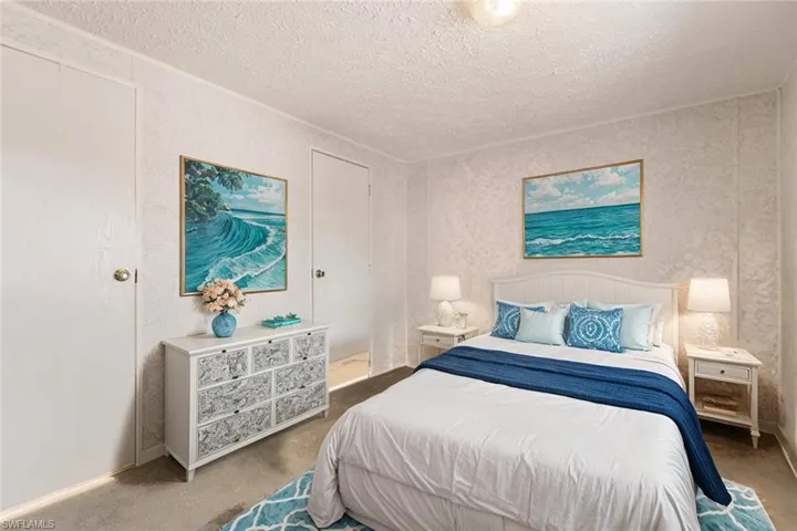 Virtually staged carpeted bedroom #2 with attached half bath