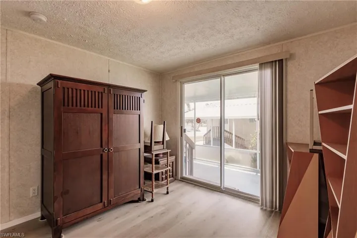 Bedroom #1 with sliders to lanai