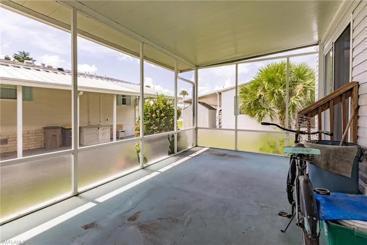 Screened lanai with entrance from carport