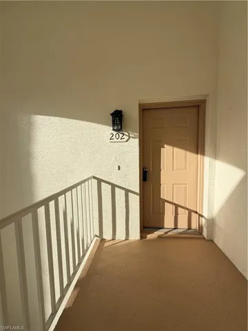 View of exterior entry with stucco siding