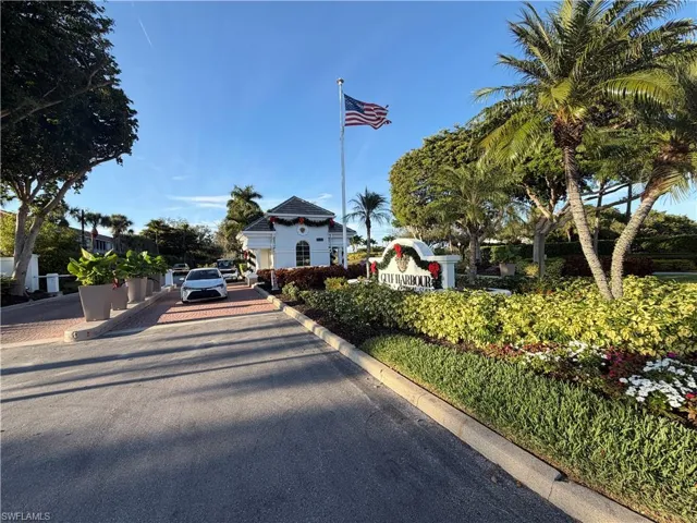View of asphalt road featuring curbs