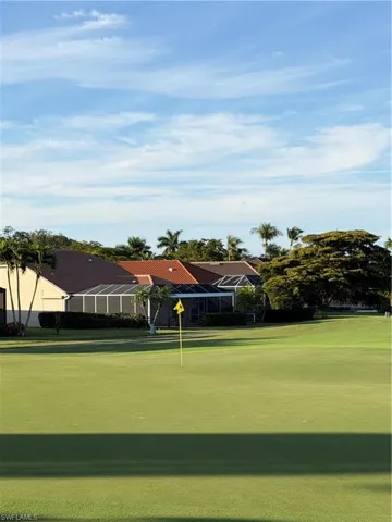 View of property's community with view of golf course and an area to practice putting