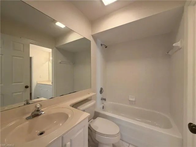 Bathroom featuring vanity and bathing tub / shower combination