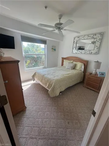 Bedroom featuring carpet and ceiling fan