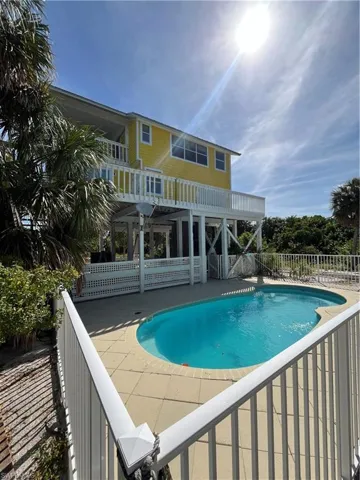 View of pool featuring a pergola and a patio area