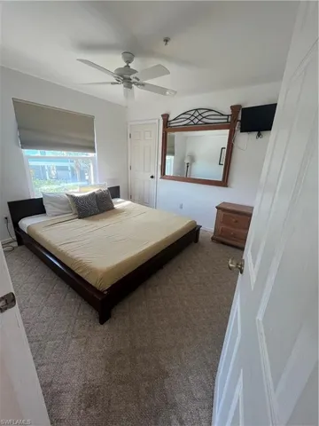 Bedroom featuring carpet and ceiling fan