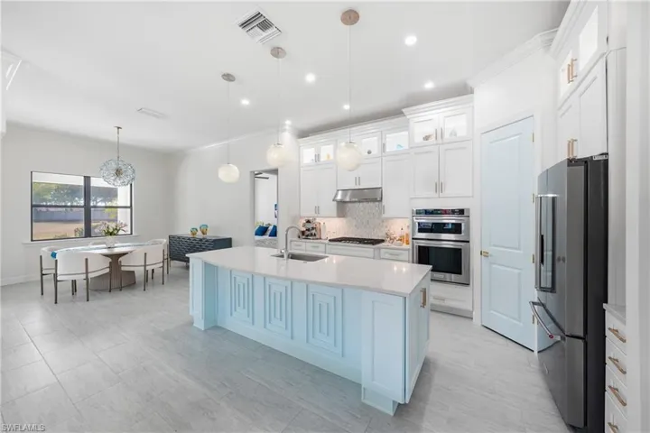Updated kitchen with freshly painted cabinetry and modern finishes