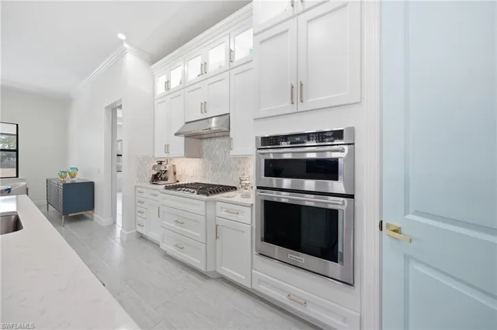 Updated kitchen with freshly painted cabinetry and modern finishes