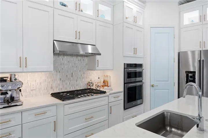 Updated kitchen with freshly painted cabinetry and modern finishes