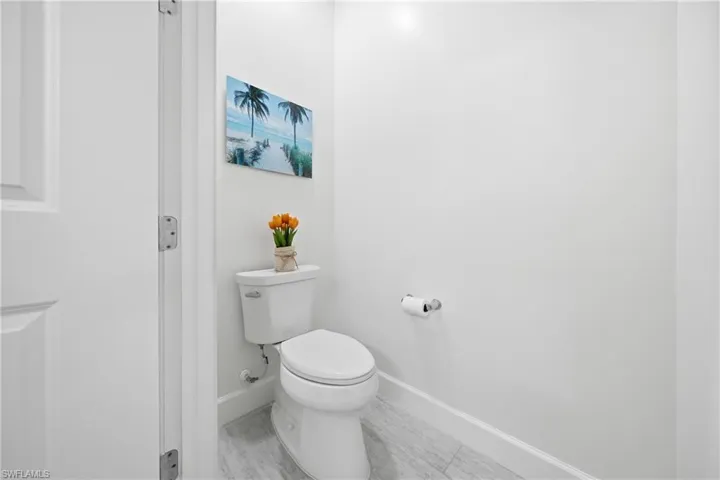 Primary bathroom featuring dual vanities, fresh paint, updated lighting, and a clean, well-maintained layout designed for everyday comfort.