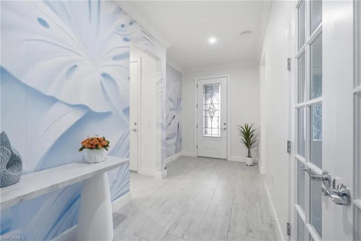 Welcoming interior entry with freshly painted walls, updated lighting, and a bright, open feel that sets the tone for the home’s refreshed interior. Clean architectural lines create an inviting first impression upon entry.