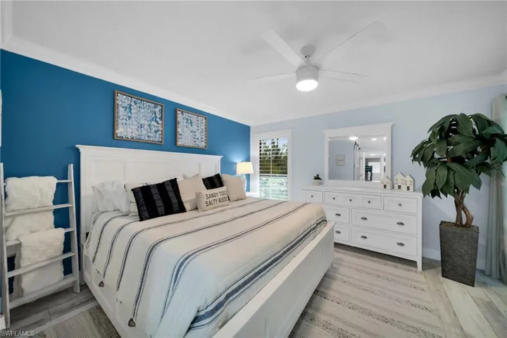 Master Bedroom overlooking the lake and water feature, Sliding Glass Doors into sunroom
