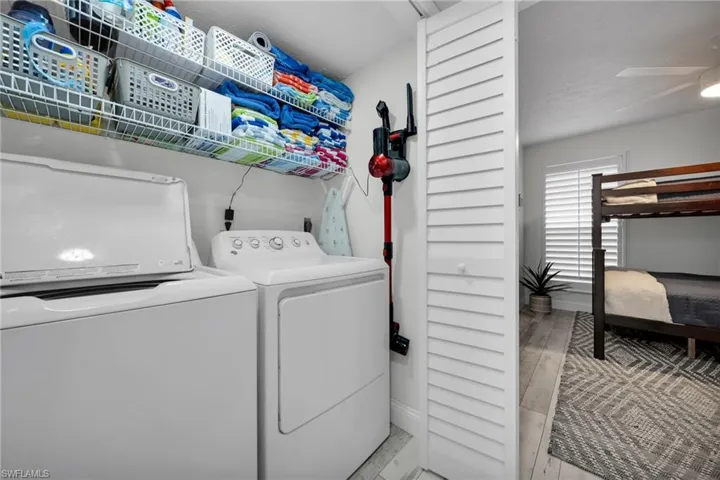 Laundry room with washing machine and clothes dryer