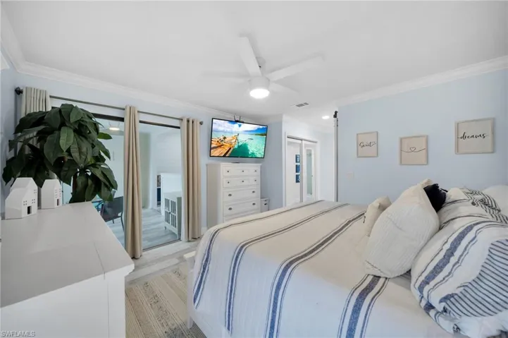 Master Bedroom with sliders to sunroom