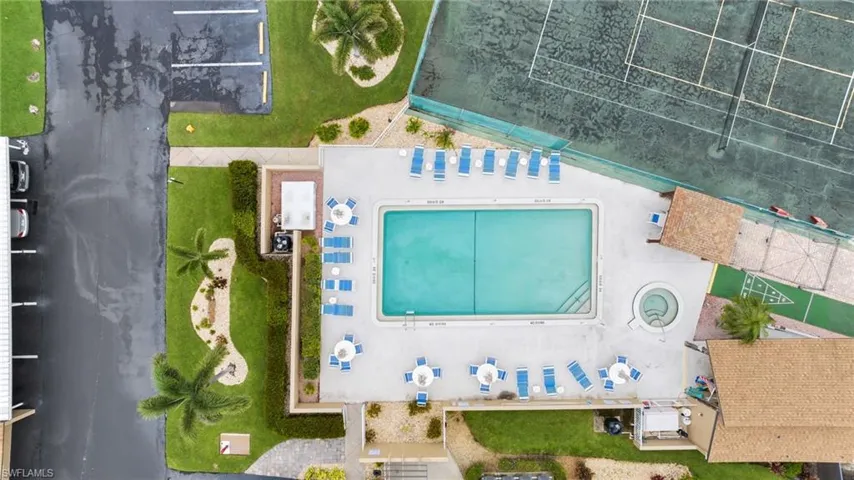 Overhead of pool area with hot tub and tennis court