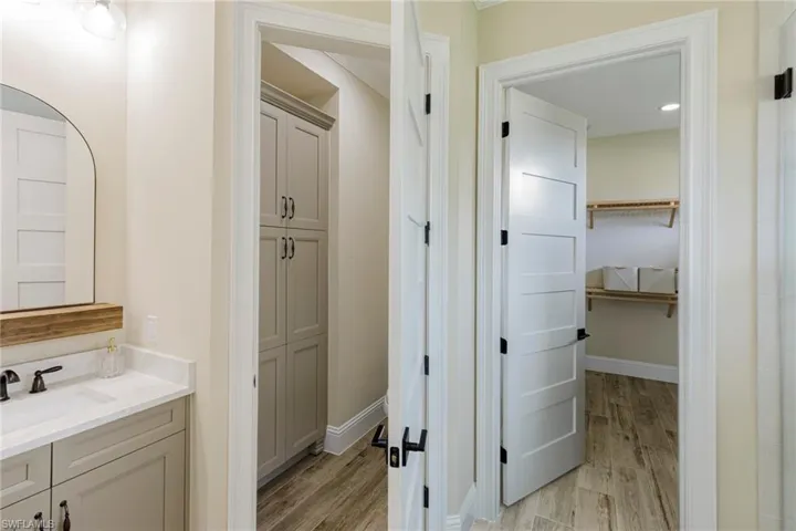 Bathroom featuring vanity and hardwood / wood-style floors