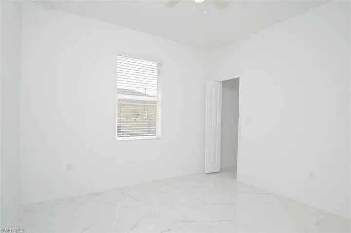 Spare room with ceiling fan